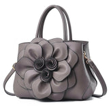 Bolsa Floral Luxe em Couro Impermeável